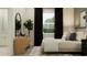Bright bedroom with modern decor, black curtains, a stylish bed and a beautiful view at 6834 E 115Th St, Palmetto, FL 34221