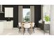 Modern dining room features seating for six around a wood table, with black accent wall and white cabinets at 6834 E 115Th St, Palmetto, FL 34221
