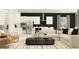 Open-concept living room and kitchen boasts stainless appliances and sleek, modern design at 6834 E 115Th St, Palmetto, FL 34221