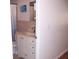 Cozy bathroom featuring a white vanity with sink, a shower, and tiled wall features at 8455 112Th St # 202, Seminole, FL 33772
