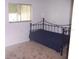 Bright spare bedroom showing a bed and window letting in natural light at 8455 112Th St # 202, Seminole, FL 33772