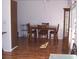 Charming dining room with table, seating for four, wood laminate floors and natural light at 8455 112Th St # 202, Seminole, FL 33772