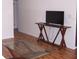 View of living room featuring a TV on a console table and laminate wood flooring at 8455 112Th St # 202, Seminole, FL 33772