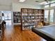 Relaxing reading room with a large bookshelf, comfortable chair, and natural light at 8455 112Th St # 202, Seminole, FL 33772
