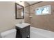 Beautiful bathroom with tiled shower, vanity, updated fixtures, and clean lines for a spa-like experience at 867 50Th N Ave, St Petersburg, FL 33703