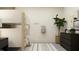 Shared bedroom featuring a white bunk bed, dark dresser, stylish decor, and striped rug at 9296 Gladsome Dr, Land O Lakes, FL 34637