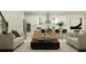 Open-concept living and kitchen area with modern appliances and stylish decor at 9296 Gladsome Dr, Land O Lakes, FL 34637
