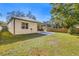 Expansive backyard with a new patio, lush lawn, and privacy fence, perfect for outdoor living at 9310 N Willow Ave, Tampa, FL 33612