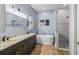 This bathroom features double sinks with granite countertops, a stand-alone tub and tiled shower at 9310 N Willow Ave, Tampa, FL 33612
