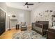 This Bedroom features wood floors, a window, a glider and a crib at 9310 N Willow Ave, Tampa, FL 33612