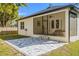 The house has a screened in patio in the backyard, with a patio pad in front at 9310 N Willow Ave, Tampa, FL 33612