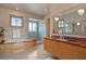 Bright bathroom features a marble countertop vanity, bathtub, and glass shower at 950 Monterey Ne Pt, St Petersburg, FL 33704