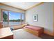 Bright bedroom with a large window offering picturesque lake views and a trundle bed at 950 Monterey Ne Pt, St Petersburg, FL 33704