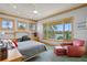 Bedroom with a stylish desk, reading chair, and scenic water views at 950 Monterey Ne Pt, St Petersburg, FL 33704