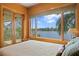 Bedroom with large windows and doors, offering a stunning waterfront view at 950 Monterey Ne Pt, St Petersburg, FL 33704