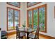 Charming dining area with beautiful views from large windows and hardwood floors at 950 Monterey Ne Pt, St Petersburg, FL 33704