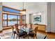 Elegant dining area featuring a glass table, stylish chairs, and large windows offering serene views of the water at 950 Monterey Ne Pt, St Petersburg, FL 33704