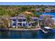 Exceptional waterfront estate boasting a private dock and boat lift, surrounded by lush tropical landscaping at 950 Monterey Ne Pt, St Petersburg, FL 33704