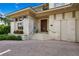Elegant front entrance with stone accents, steps leading to the double doors, and tasteful landscaping at 950 Monterey Ne Pt, St Petersburg, FL 33704