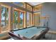 Entertaining game room with a pool table and stunning views of the water at 950 Monterey Ne Pt, St Petersburg, FL 33704