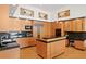 Modern kitchen with custom wood cabinetry, granite countertops, and stainless steel appliances, perfect for culinary enthusiasts at 950 Monterey Ne Pt, St Petersburg, FL 33704