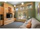 Comfortable living room with built-in shelving and large windows providing plenty of natural light at 950 Monterey Ne Pt, St Petersburg, FL 33704