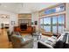 Relaxing living room with hardwood floors, comfortable seating, and large windows providing stunning views of the waterfront scenery at 950 Monterey Ne Pt, St Petersburg, FL 33704