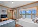 Spacious primary bedroom with water views, large windows, and a soft color palette at 950 Monterey Ne Pt, St Petersburg, FL 33704