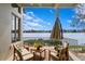 Inviting outdoor seating area overlooking a serene lake, perfect for relaxing and entertaining at 950 Monterey Ne Pt, St Petersburg, FL 33704