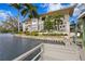 Gorgeous multi-story home with a private dock, waterfront views, and lush tropical landscaping at 950 Monterey Ne Pt, St Petersburg, FL 33704