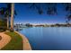 Scenic waterfront view at night, showcasing the serene waters and well-manicured landscaping along the shoreline at 950 Monterey Ne Pt, St Petersburg, FL 33704