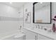 A modern bathroom with stylish tiles, a bathtub, and contemporary fixtures at 9845 84Th Way, Seminole, FL 33777