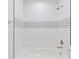 Modern bathroom with white tiled shower and stylish black and white accents at 9845 84Th Way, Seminole, FL 33777