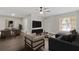 Open concept living space with a cozy seating area and a dining set for entertaining at 9845 84Th Way, Seminole, FL 33777