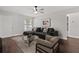 Stylish living room showcasing a comfortable sofa, contemporary decor, and natural light at 9845 84Th Way, Seminole, FL 33777