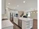 Bright kitchen with stainless steel appliances, quartz counters, and a large island at 11486 June Briar Loop, San Antonio, FL 33576