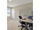 Functional home office with a desk, chair, white board, and natural light at 11486 June Briar Loop, San Antonio, FL 33576