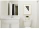 Clean bathroom featuring a modern vanity with a sleek, white countertop, complementing fixtures and a decorative plant at 11849 Blue Diamond Trl, Parrish, FL 34219