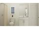 Clean, well-lit bathroom with white subway tile in shower, white vanity and framed art at 11856 Blue Diamond Trl, Parrish, FL 34219