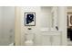 Bright bathroom featuring a single sink vanity with white cabinets and a tub with a beige curtain at 11856 Blue Diamond Trl, Parrish, FL 34219