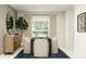 Dining room with table, chairs, stylish sideboard and decorative accessories at 11856 Blue Diamond Trl, Parrish, FL 34219