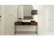 Entryway features a wood console table, modern mirror, and stylish lamp at 11856 Blue Diamond Trl, Parrish, FL 34219