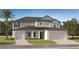 Two-story home with a neutral color scheme, a well-manicured lawn and a two-car garage at 11856 Blue Diamond Trl, Parrish, FL 34219