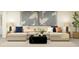 Comfortable living room with a sectional sofa, accent pillows, and contemporary coffee table at 11856 Blue Diamond Trl, Parrish, FL 34219