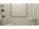 Stylish powder room featuring a modern floating sink, clean lines, and elegant decorative elements at 11856 Blue Diamond Trl, Parrish, FL 34219