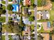 Aerial view of the property showcasing its landscaping, neighborhood, and proximity to local amenities at 1281 St Andrews Dr, Dunedin, FL 34698