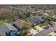 Overhead shot of a neighborhood highlighting tree coverage, rooftops, and street layout at 1422 Appleton Pl, Wesley Chapel, FL 33543