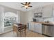 Bright kitchen nook with wood floors, butcher block counters, and a large window at 1422 Appleton Pl, Wesley Chapel, FL 33543