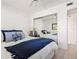 Comfortable bedroom includes a mirrored closet, providing ample storage space and a brighter ambiance at 1728 Golfview Dr # 1728, Tarpon Springs, FL 34689
