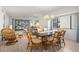 Open living and dining area featuring neutral paint, lots of natural light, and stylish furniture at 1728 Golfview Dr # 1728, Tarpon Springs, FL 34689